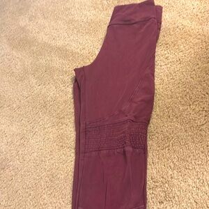 Maroon/purple leggings with detail as seen in photo. Size small.